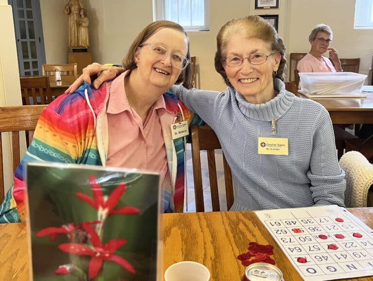 Sister Rebecca White, left, and Sister Claudia Hayden are happy to play bingo together.