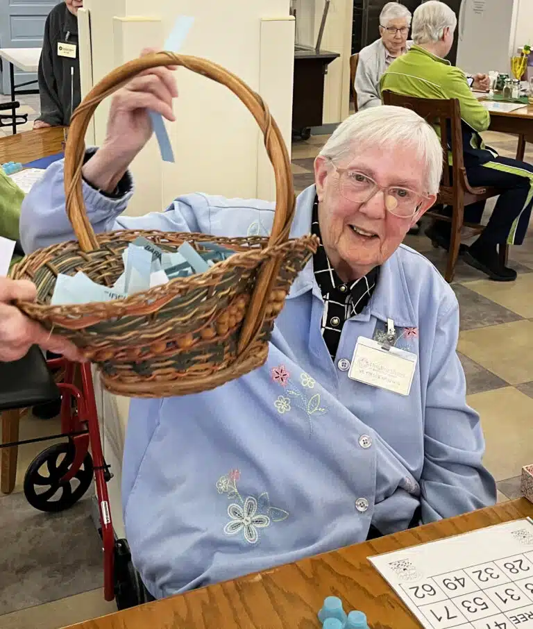 Sister Grace Simpson hopefully pulls a winner from the basket. Sister Grace Simpson hopefully pulls a winner from the basket.