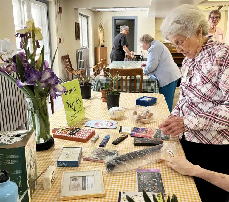 Sister Elaine Burke checks out the gift table for her impending victory. Sister Elaine Burke checks out the gift table for her impending victory.