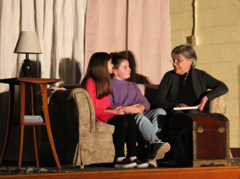 Debbie Reynolds, right, playing the grandmother Alice, shares the story of the Ursuline Sisters to her “granddaughters,” played by Miranda Bolin, left, and Kate Hamilton, in the play “Legacy Sisters.”