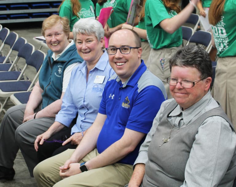 Ursuline Sisters Helena Fischer, left, and Pam Mueller, second from left, join Josh Clary, Dean of Students at Brescia University, and Sister Darlene Presley, superior of the Glenmary Sisters.