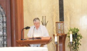 Sister Ruth Gehres read the Scripture for the ceremony, Matthew 28: 18-20.
