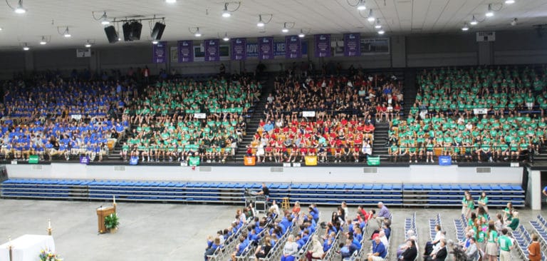 Students filled the seats on both sides of the Sportscenter, giving a clear picture of why this is called a “Rainbow Mass.” Bishop Medley said the biblical character Noah would recognize the rainbow of faith just by seeing everyone’s shirts.