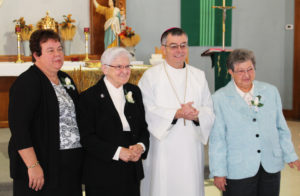 A few of the jubilarians had their picture taken with Bishop Medley after the service. From left are Sisters Martha Keller, George Mary Hagan and Ruth Mattingly.