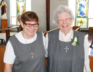 Glenmary Sister Catherine Schoenborn, right, was honored for 65 years of service. She smiles here with the president of her community, Sister Sharon Miller.