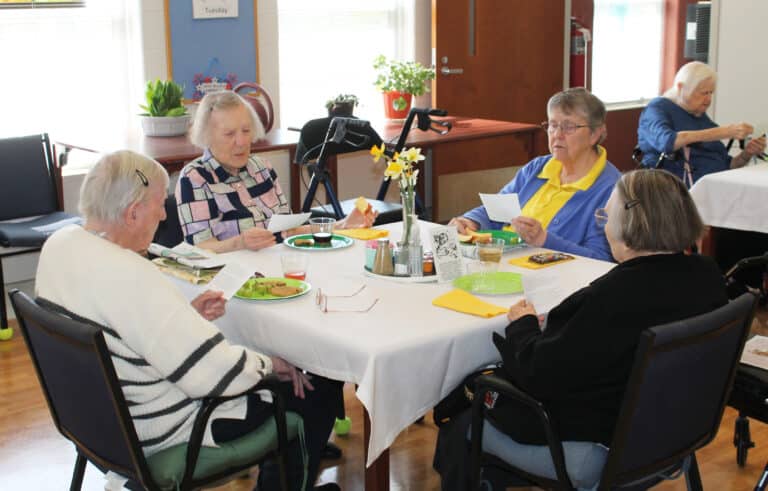 The Sisters read a prayer to Saint Joseph together at their table. From left are Sister Grace Simpson, Sister Marie Carol Cecil, Sister Melissa Tipmore, and Sister Lois Lindle.