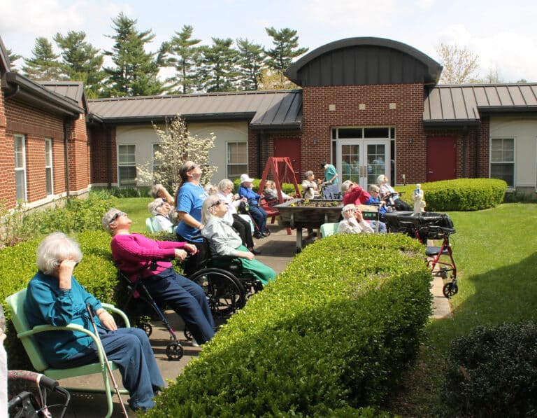 The Sisters gather in the courtyard of Saint Joseph Villa to watch the eclipse.