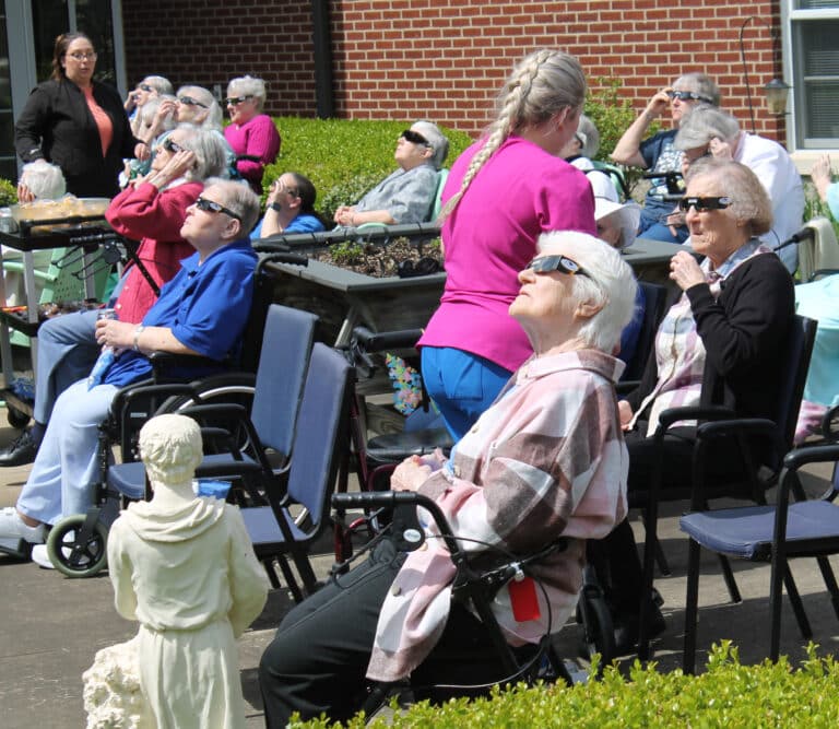 Sister Mary Matthias Ward has a good seat as she and other Sisters prepare for the eclipse.