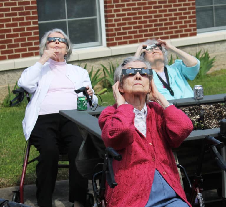 Sister Catherine Barber, left, sees something impressive, as Sister Mary Gerald Payne, center, and Sister Pat Rhoten gaze at the sky.