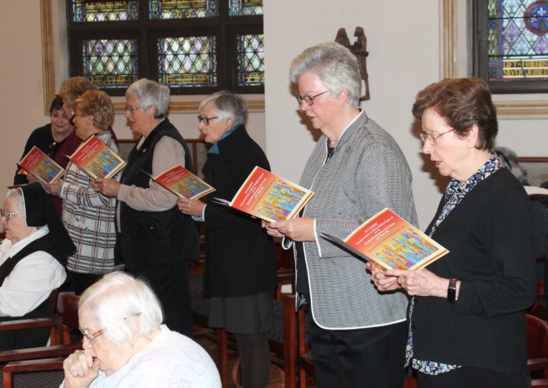 Singing the opening hymn, “Jesus, Lord Have Mercy” are, from right, Sister Mary Henning, Sister Mary Timothy Bland, Carolyn McCarty, Sister Rita Scott, Associate Carol Hill, Associate Suzanne Reiss and Associate Bonnie Marks