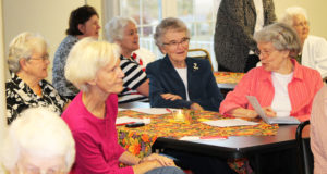Sister Catherine Barber, right, discusses Merton with Sister Ann Patrice Cecil, second from right, Sister Cecelia Joseph Olinger, left, and Mary Helen Nash.