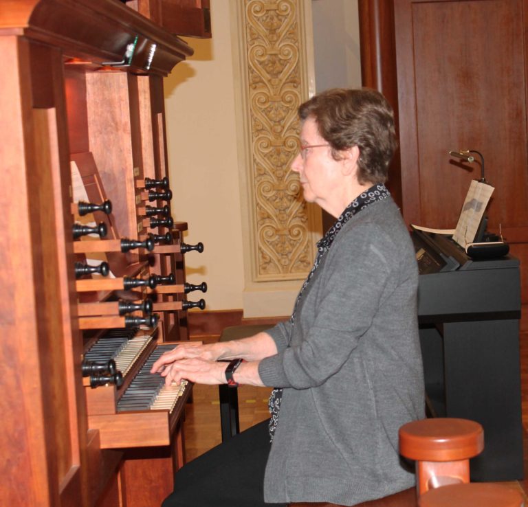 Sister Mary Henning, A64, plays the organ during the opening hymn.