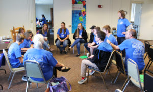 The teens broke into small groups in Conference Room A to discuss substance abuse prevention programs at their schools. Standing at right is Becky Horn, health educator with the Green River District Health Department.