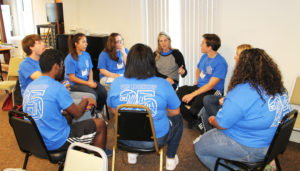 Each group of teens had adult staff members working with them. The goal is to get the teens to develop programs for their schools to reach at-risk students.
