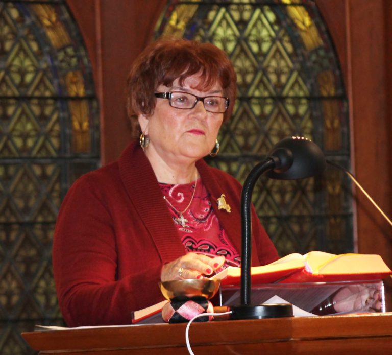 Maggie Jenkins Beville, A65, reads from the Book of Wisdom. Her sister, Ann Jenkins Caspar, was one of the alumnae being remembered at Mass.