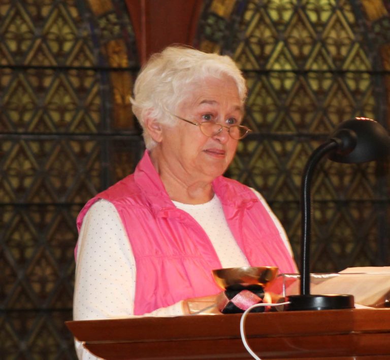 Marian Bennett, honorary alumna, reads the intercessions.