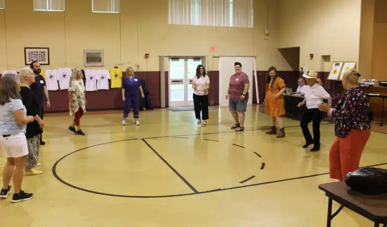 Sister Elaine Burke, second from right in the cowboy hat, leads the line dancing to “Boot Scootin’ Boogie” on June 8 in Maple Hall. Sister Elaine Burke, second from right in the cowboy hat, leads the line dancing to “Boot Scootin’ Boogie” on June 8 in Maple Hall.