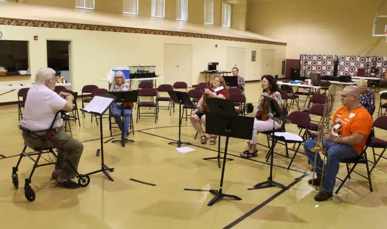 James White, left, talks with a few of the musicians who took part in a “play-in,” a chance for some people who haven’t played in a while to get out their instruments again. James White, left, talks with a few of the musicians who took part in a “play-in,” a chance for some people who haven’t played in a while to get out their instruments again.