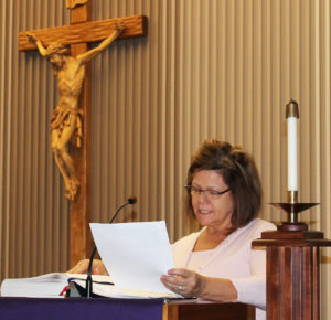 Ursuline Associate Debbie Lanham reads the opening prayer.