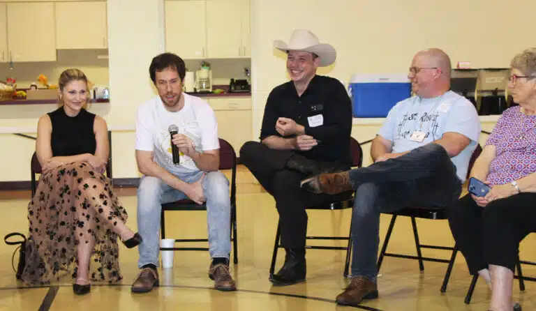 Matt Layson, holding the microphone, tells the story of being a “scared tuba player” at the camp, where he attended from 1998-2005. His wife Amanda is at left. To his right are Bryan Heath, Sean Corbett and Sister Betsy Moyer, who was helping with the event. Matt Layson, holding the microphone, tells the story of being a “scared tuba player” at the camp, where he attended from 1998-2005. His wife Amanda is at left. To his right are Bryan Heath, Sean Corbett and Sister Betsy Moyer, who was helping with the event.