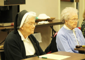 Ursuline Sisters Joseph Angela Boone, left, and Alfreda Malone listen to Sister Pam say that allowing time to rebound can be a “season of replenishment.”