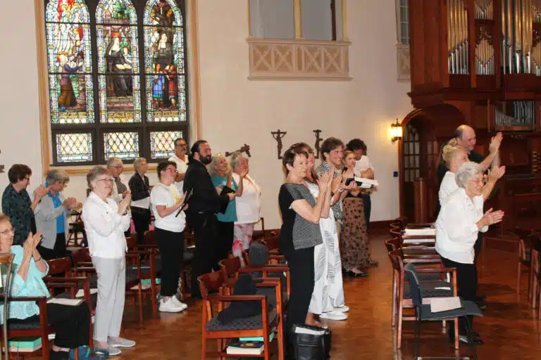 The Sisters, guests and fellow musicians give Michael Coonrod a standing ovation after his performance. Coonrod taught at the Interlochen Arts Academy in Michigan for 46 years. The Sisters, guests and fellow musicians give Michael Coonrod a standing ovation after his performance. Coonrod taught at the Interlochen Arts Academy in Michigan for 46 years.