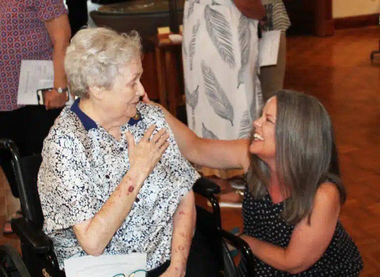 Tammy Chapman Bisotti, right, laughs with Sister Pat Rhoten following the concert. Bisotti said visiting Sister Pat earlier in the weekend was one of the highlights for her. Sister Pat volunteered at the camp, and always answered the student’s questions honestly about living religious life, Bisotti said. Tammy Chapman Bisotti, right, laughs with Sister Pat Rhoten following the concert. Bisotti said visiting Sister Pat earlier in the weekend was one of the highlights for her. Sister Pat volunteered at the camp, and always answered the student’s questions honestly about living religious life, Bisotti said.