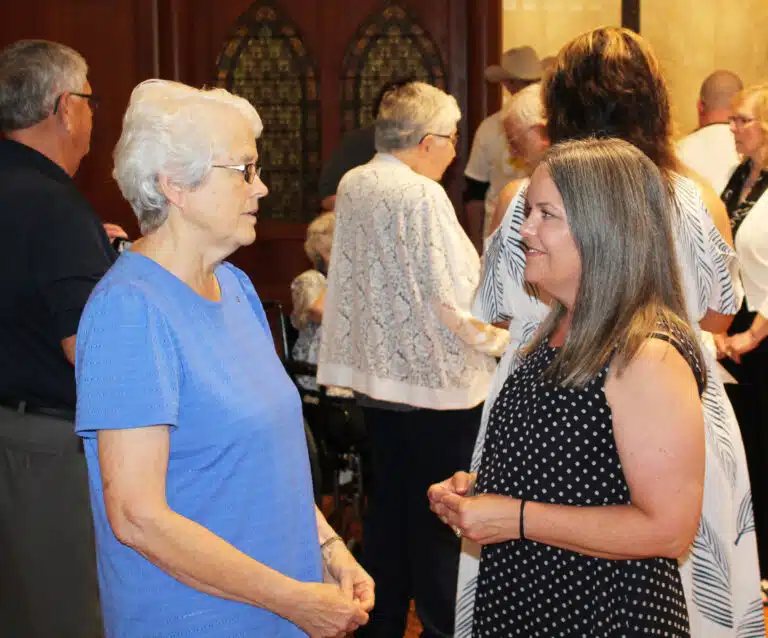 Sister Barbara Jean Head, left, talks with Tammy Chapman Bisotti, who she remembered from her time helping at the camp. Sister Barbara Jean Head, left, talks with Tammy Chapman Bisotti, who she remembered from her time helping at the camp.
