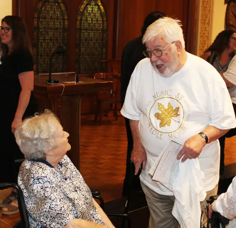 James White, the founder and director of the camp, talks with Sister Pat Rhoten, who volunteered at the camp. James White, the founder and director of the camp, talks with Sister Pat Rhoten, who volunteered at the camp.