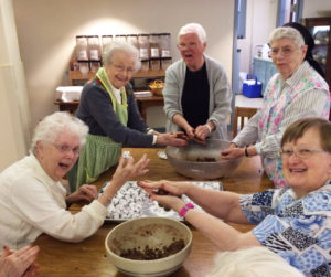 The expressions on their faces lets you know this is a group that was having fun as they rolled each bourbon ball by hand. From left are Sisters Mary Agnes VonderHaar, Alfreda Malone, Mary Jude Cecil, Michael Ann Monaghan and Rebecca White.