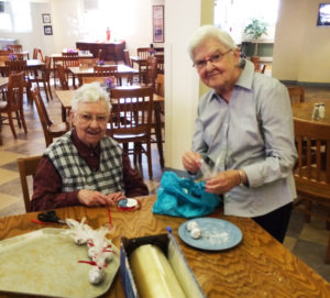 Sisters Marie Bosco Wathen, left, and George Mary Hagan package the bourbon balls for the Kansas guests.