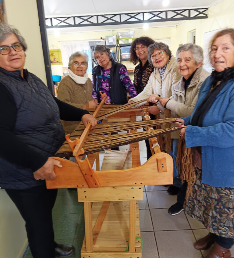 A group of weavers work together at Casa Ursulina. A group of weavers work together at Casa Ursulina.