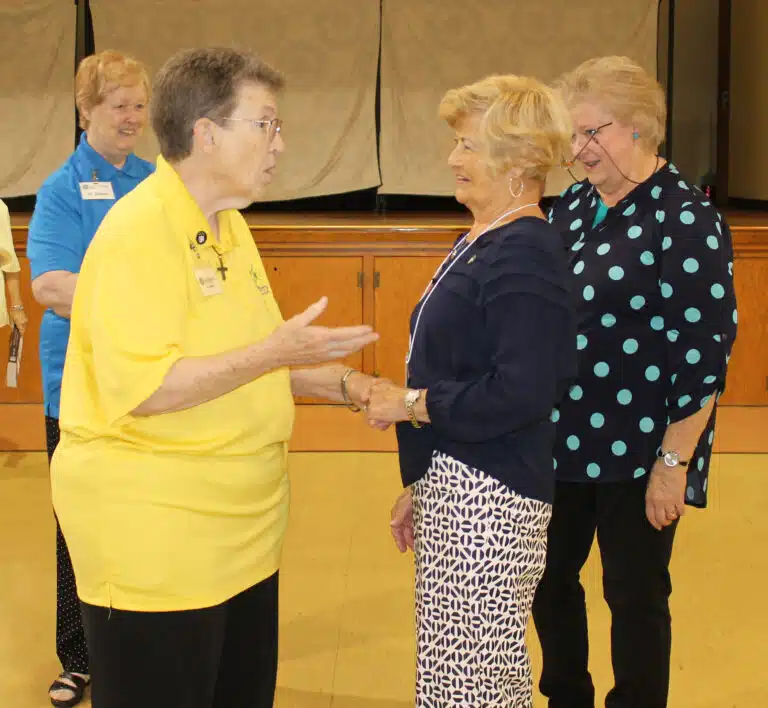 Sister Sharon Sullivan, left, talks with Grayson County Associate Carol Hill, as Sister Helena Fischer, far left, and Associate Suzanne Reiss look on. Sister Sharon Sullivan, left, talks with Grayson County Associate Carol Hill, as Sister Helena Fischer, far left, and Associate Suzanne Reiss look on.
