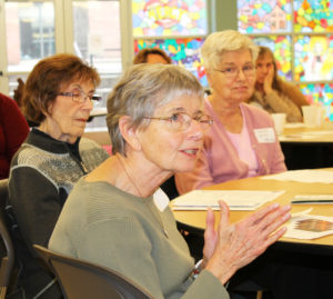 Ursuline Associate Lily Cloughley makes a point about the importance of spirituality during the discussion period. Looking on at left is Ursuline Associate Mariita Rodriguez and Ursuline Sister Jane Falke.
