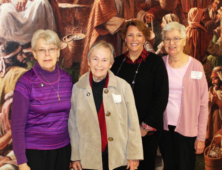 New Ursuline Associates pose with a photo with their contact sisters. From left are Sister Angela Fitzpatrick, Associate Kay Howa, Associate Lisa Guenther and Sister Jane Falke.