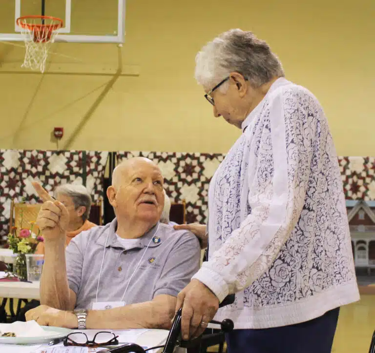 Associate George Horishny talks with Sister Ruth Gehres. Associate George Horishny talks with Sister Ruth Gehres.