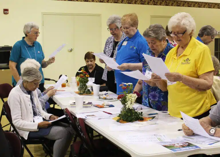Ursuline Sisters stand to read the response of the community to the Associate recommitment. From left are Sisters Rita Scott, Mary Timothy Bland, Helena Fischer, Rose Jean Powers and Vivian Bowles. Ursuline Sisters stand to read the response of the community to the Associate recommitment. From left are Sisters Rita Scott, Mary Timothy Bland, Helena Fischer, Rose Jean Powers and Vivian Bowles.