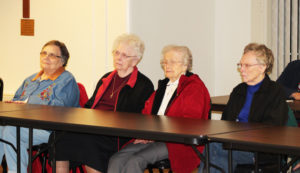 Ursuline Sisters, from left, Lois Lindle, Mary Agnes VonderHaar, Alfreda Malone and Clara Reid, listen to Bishop Medley say that he enjoyed singing Mary songs in his youth because unlike the Latin hymns used at Mass, Mary songs were in English.