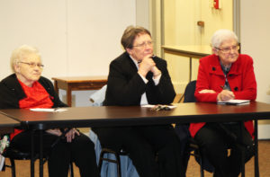 Ursuline Sisters, from left, Mary Angela Matthews, Amelia Stenger and George Mary Hagan listen to Bishop Medley say that the Second Vatican Council sought to reconcile the Catholic Church with its true history. “The Apostles did not come out the day after Pentecost saying Mass in Latin,” Bishop Medley said. “They said it in Aramaic or Hebrew, the language of the people.”