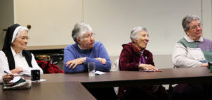 Ursuline Sisters Joseph Angela Boone, Ruth Gehres, Marietta Wethington and Rose Jean Powers listen to Bishop Medley say, “If theologians now want to preach the humanity of Jesus, does that mean Mary is out of a job? No.”