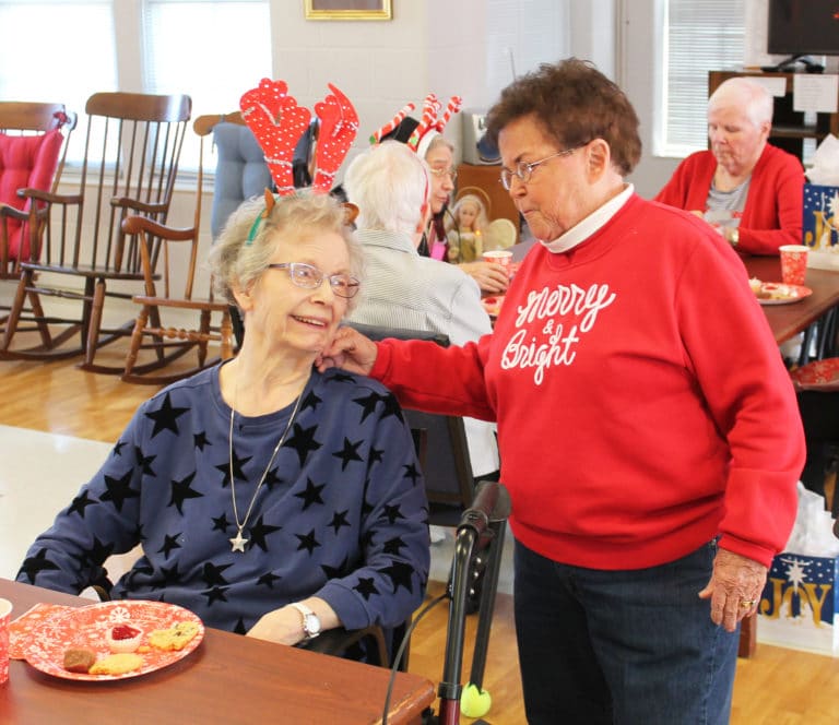 Associate Phyllis Troutman, right, visits with Sister Diane Marie Payne, her 1963 classmate from Mount Saint Joseph Academy.
