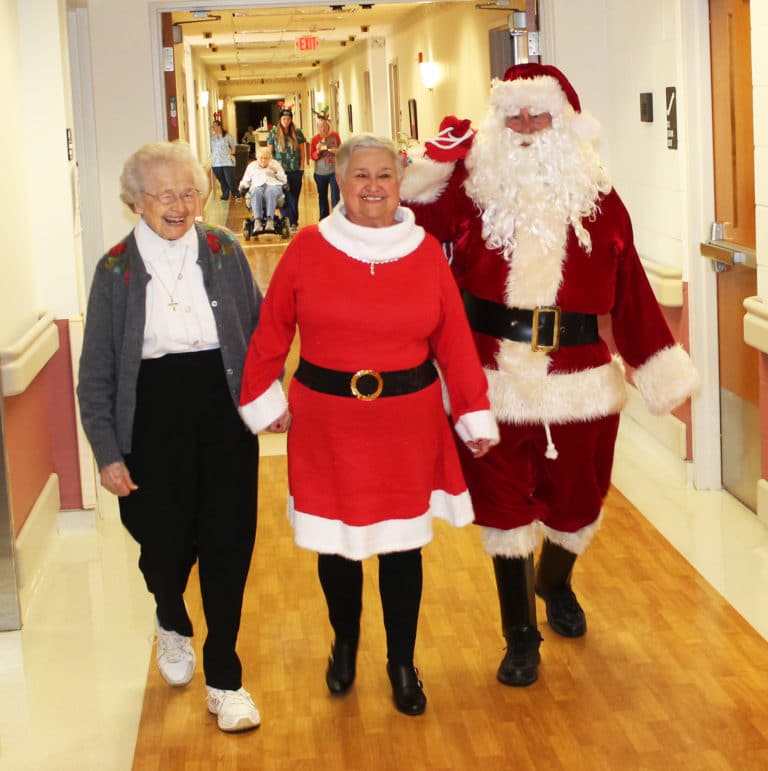 The arrival of Mr. and Mrs. Claus was such high security that they needed an escort from Sister Alfreda Malone.