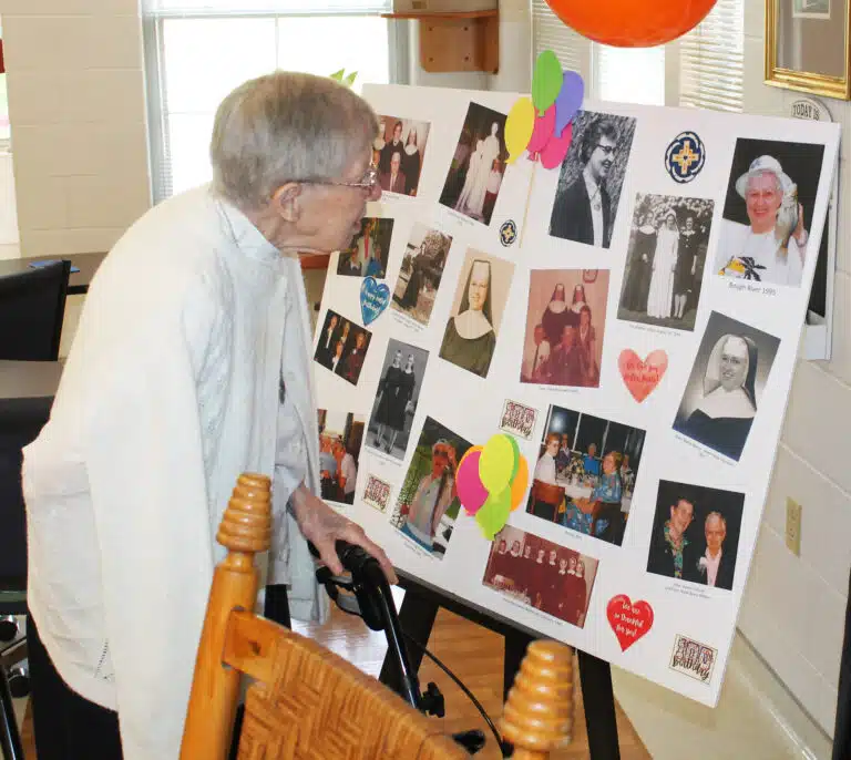 Sister Amanda Rose Mahoney looks over photos of Sister Marie Bosco through the years. Sister Amanda Rose is the fourth oldest Sister in the community. She will turn 95 in October. Sister Amanda Rose Mahoney looks over photos of Sister Marie Bosco through the years. Sister Amanda Rose is the fourth oldest Sister in the community. She will turn 95 in October.