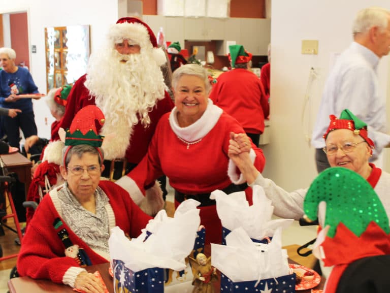 Santa and Mrs. Claus share some joy with Sister Clarence Marie Luckett, left, and Sister Marie Bosco Wathen.