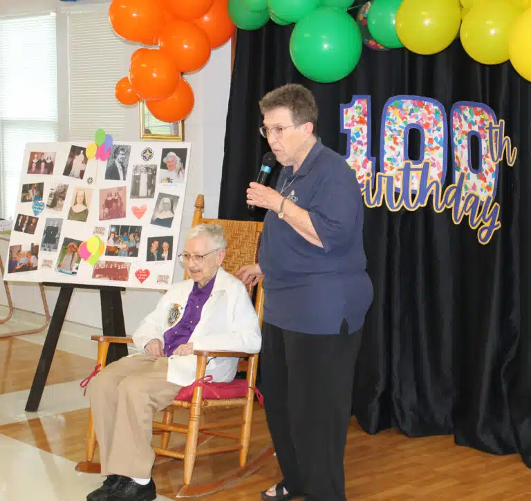 Sister Sharon Sullivan tells those assembled that Sister Marie Bosco’s classroom at Brescia College routinely erupted in laughter. “Bosco made them all feel so welcome,” she said. Sister Sharon Sullivan tells those assembled that Sister Marie Bosco’s classroom at Brescia College routinely erupted in laughter. “Bosco made them all feel so welcome,” she said.