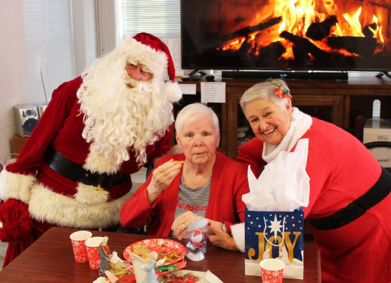 Santa and Mrs. Claus bring good wishes to Sister Mary Jude Cecil on behalf of John and Elaine Wood. Sister Mary Jude taught their granddaughter in Paducah, Ky.