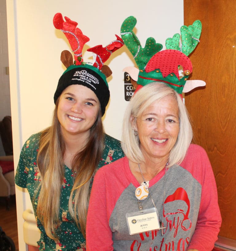 Two members of the Villa staff working the party – Rebekah McCarthy, left, and Jenny Lageson – were in the Christmas spirit.