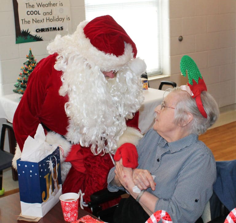 Sister Marie Goretti Browning gives Santa her final instructions for Christmas.