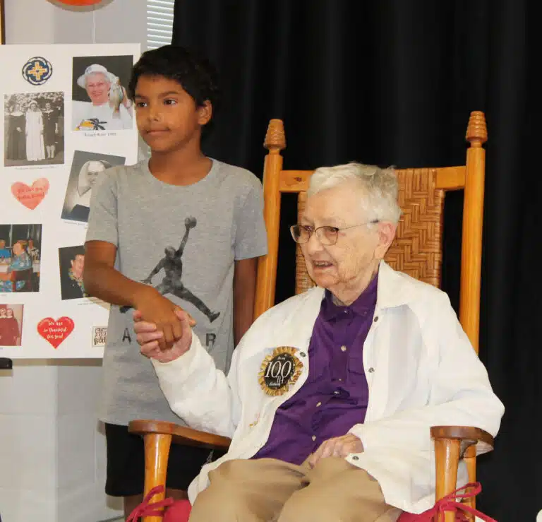 Sister Marie Bosco has struck up a friendship with Titus, the grandson of Almost Family worker Pat Burden. Titus was a surprise guest at the party. Sister Marie Bosco has struck up a friendship with Titus, the grandson of Almost Family worker Pat Burden. Titus was a surprise guest at the party.