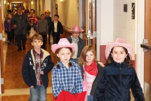 Students from Mary Carrico in kindergarten through the fourth grades took a tour of Maple Mount during the square dancing, but here they are approaching the Rainbow Room with Sister Rose Jean Powers.